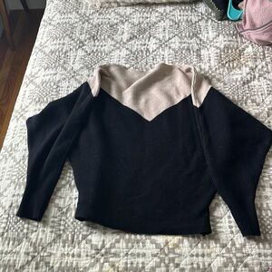 Cute black and tan sweater - stretchy.